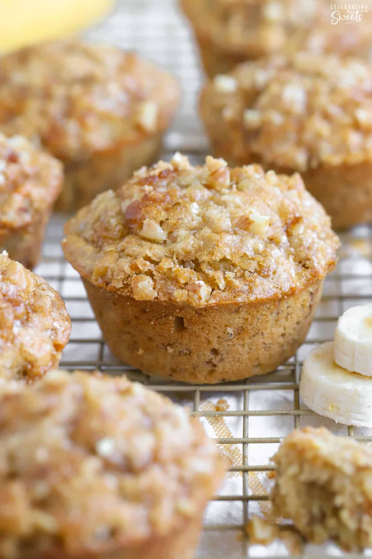 Banana nut muffins on a wire rack.