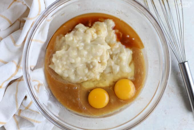 Banana nut muffin batter in a glass bowl.