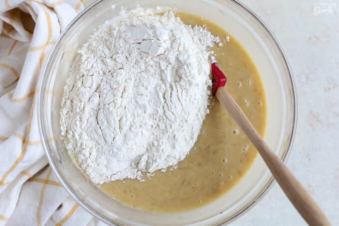 Banana nut muffin batter in a glass bowl.