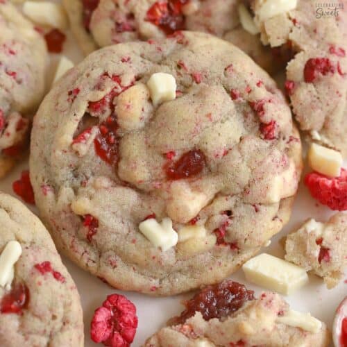 White chocolate raspberry cookie on a piece of parchment paper.