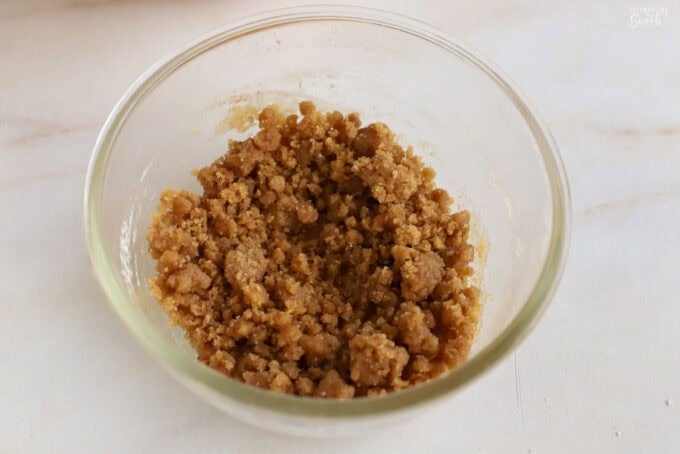 Brown sugar crumb topping in a glass bowl.