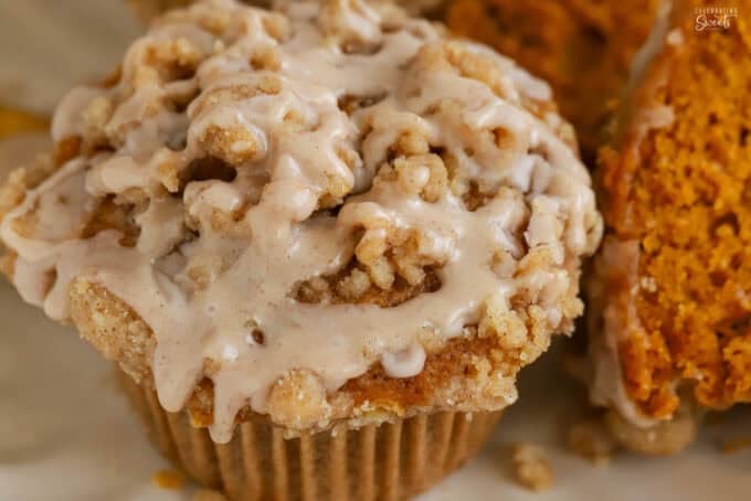 Overhead shot of a pumpkin muffin drizzled with cinnamon icing.