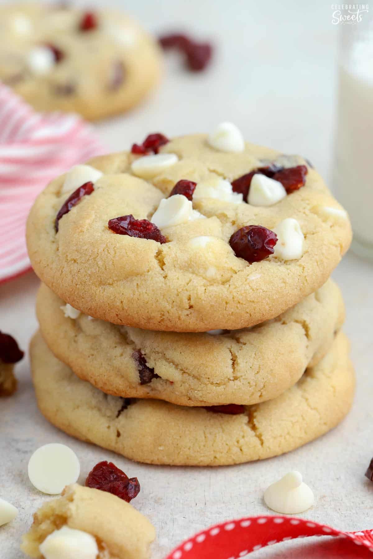 Stack of three white chocolate cranberry cookies.
