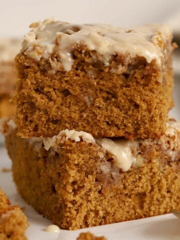 Two pieces of gingerbread cake stacked on top of each other.