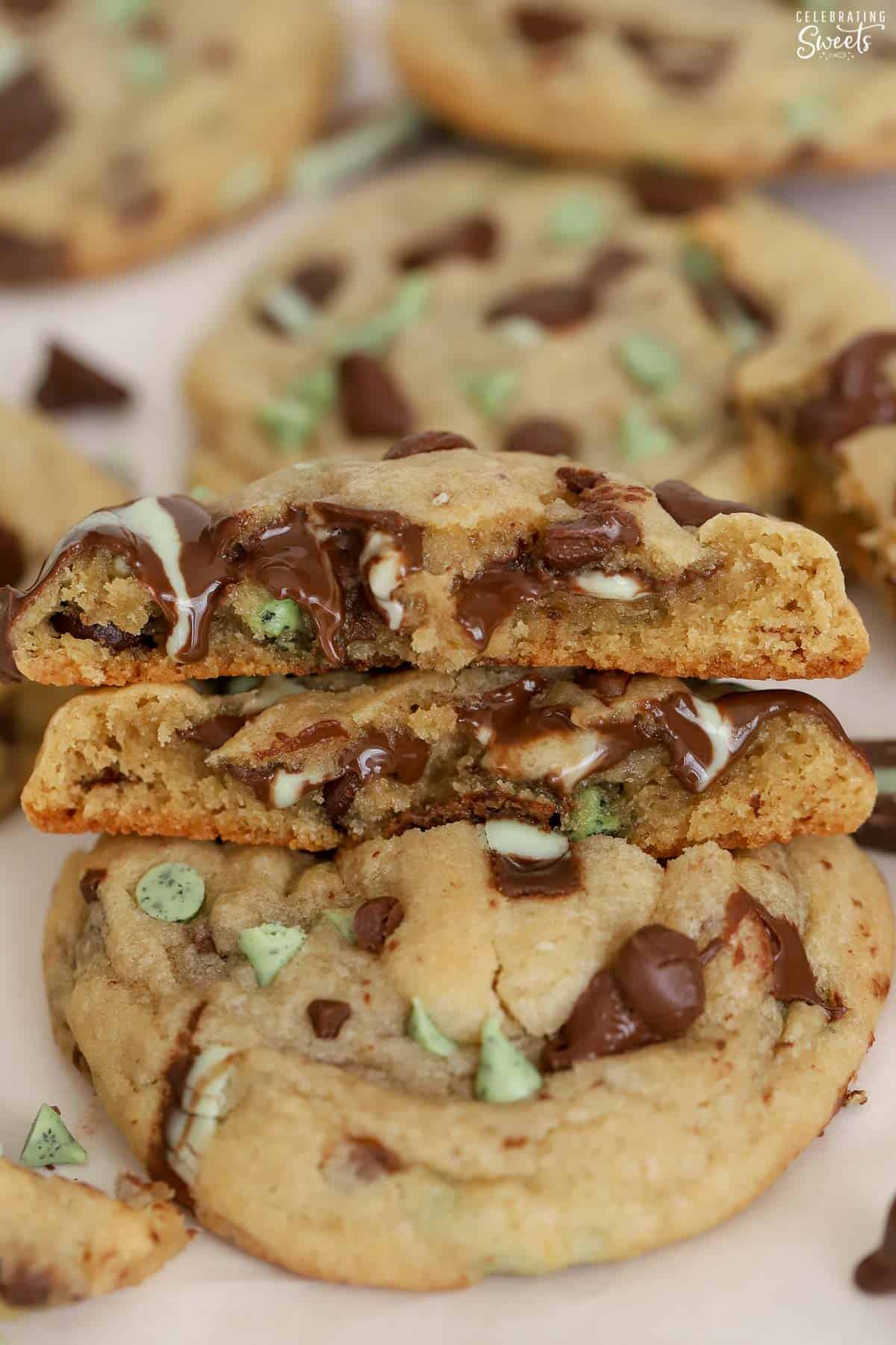 Mint chocolate chip cookie split in half stacked on top of each other.
