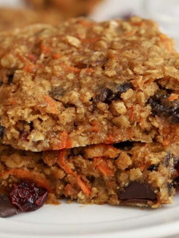 Two breakfast bars stacked on top of each other on a white plate.