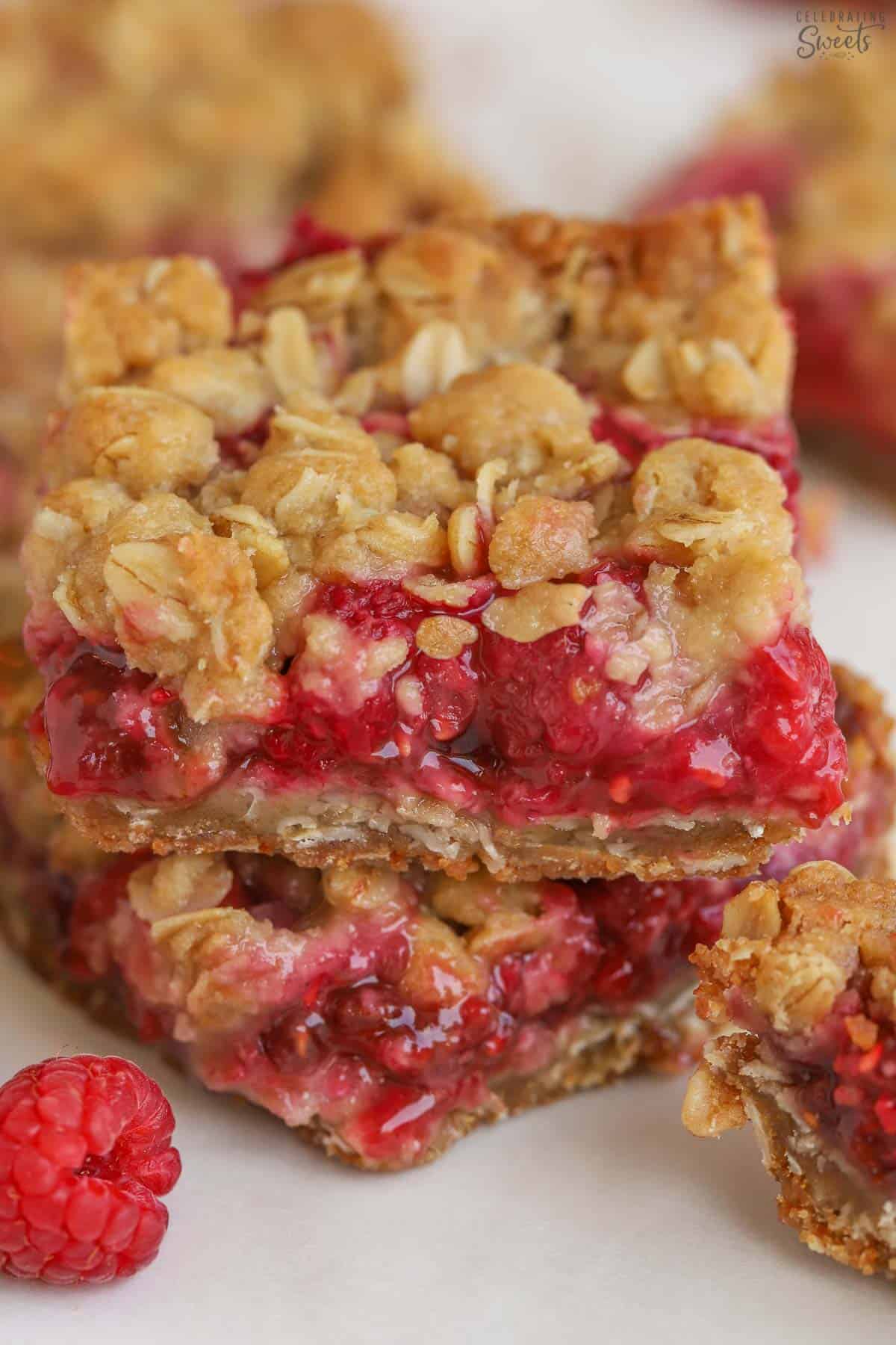 Two raspberry bars stacked on top of each other.