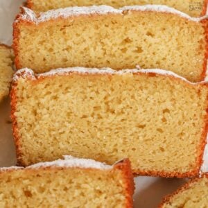 Slices of yogurt cake on a white plate.