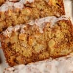 Closeup of three slices of apple fritter bread.