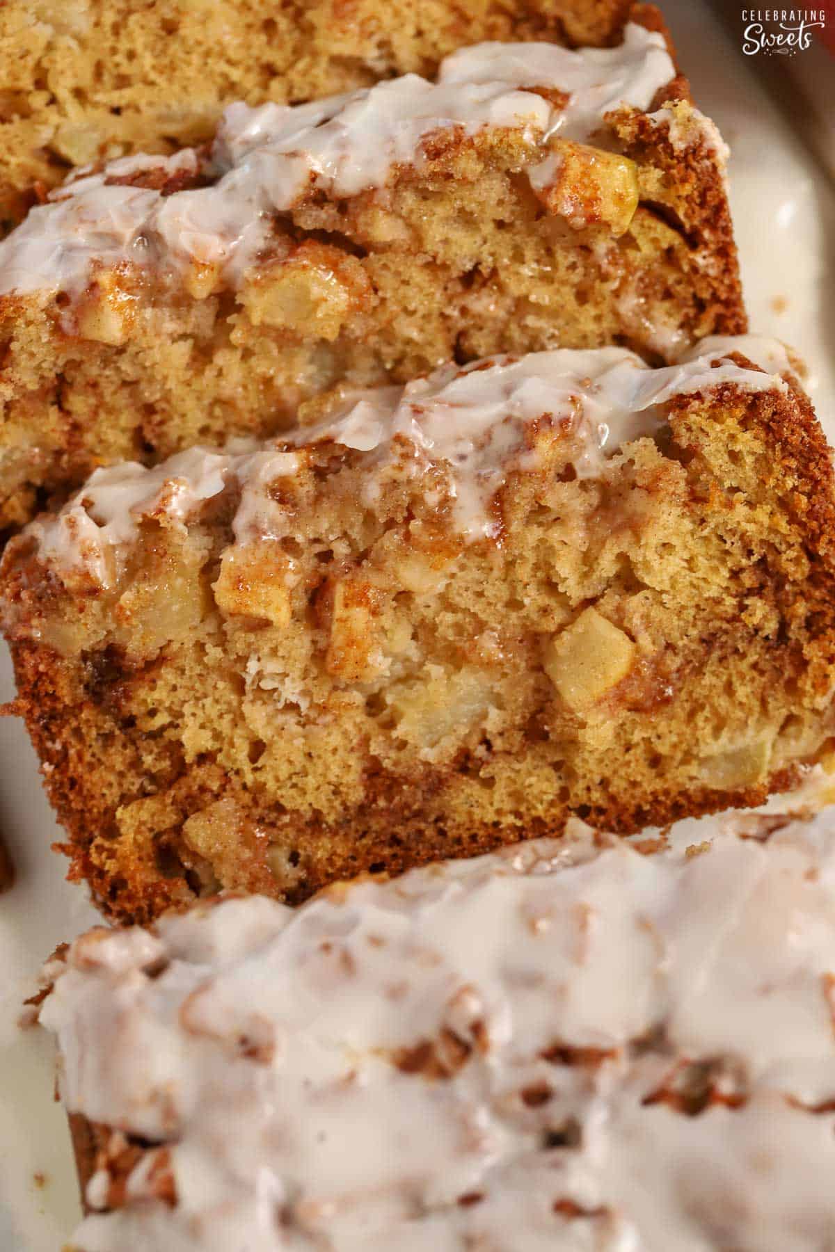 Closeup of three slices of apple fritter bread.