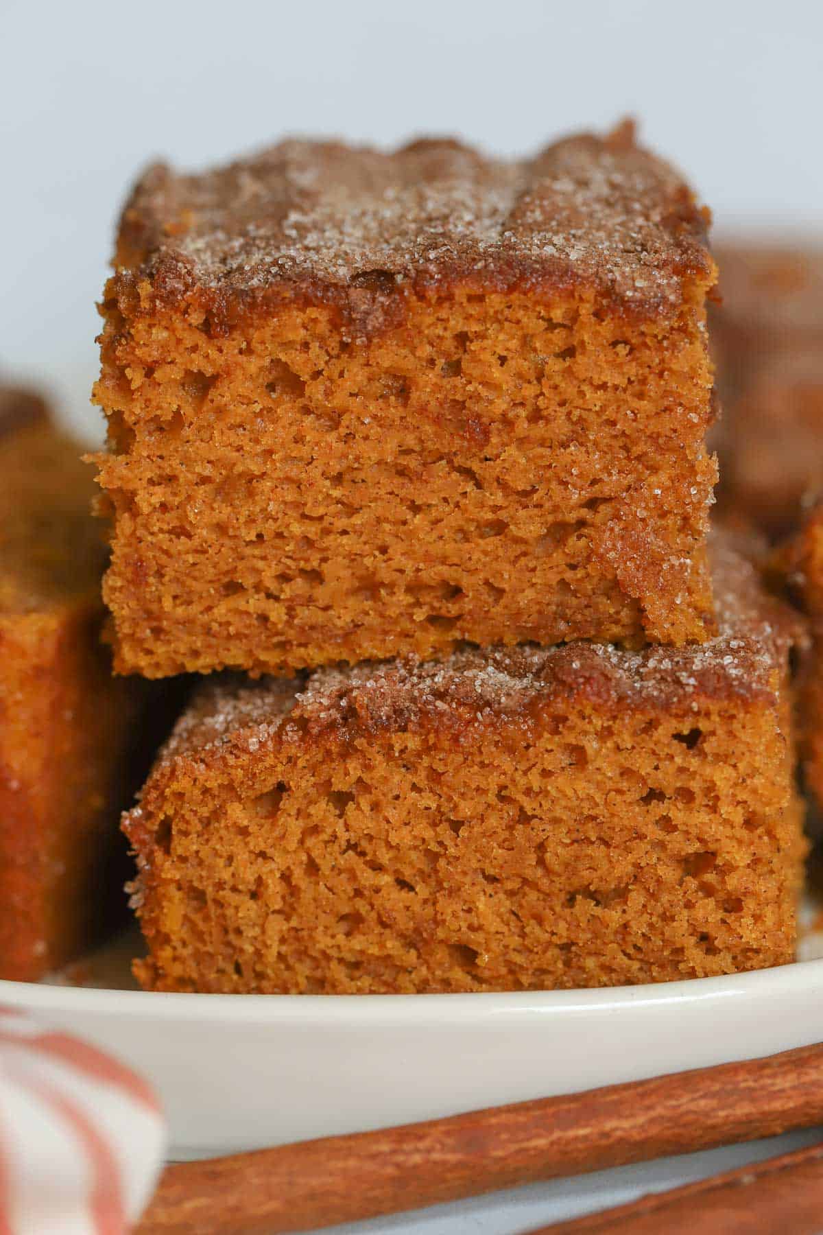 Two slices of pumpkin cake stacked on top of each other.