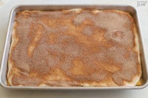 Churro toffee topped with cinnamon sugar on a baking sheet.