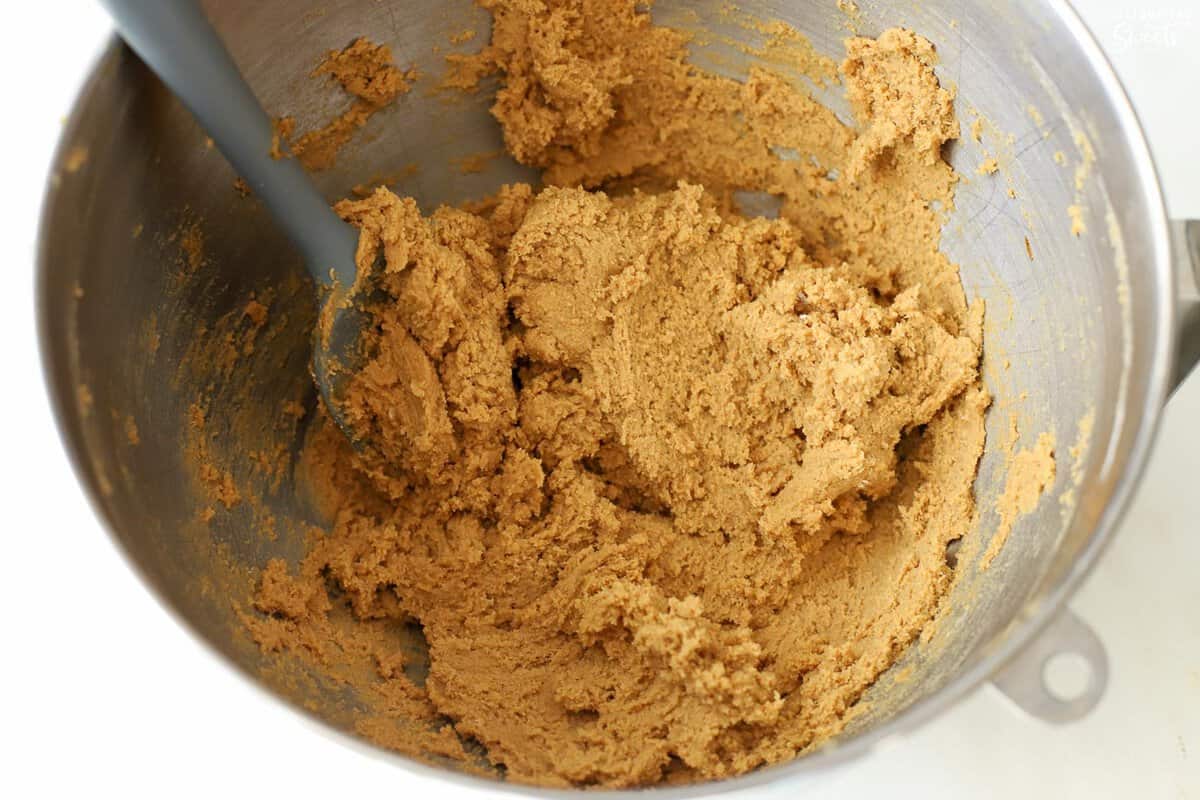 Ginger molasses cookie dough in a stainless bowl.