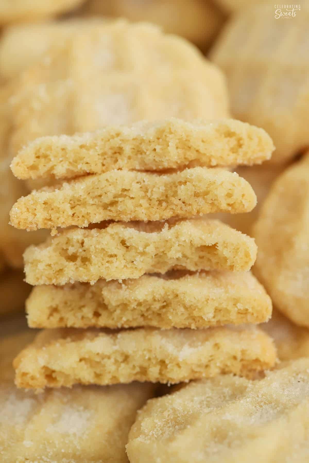 Five pieces of halved mini sugar cookies stacked on top of each other.