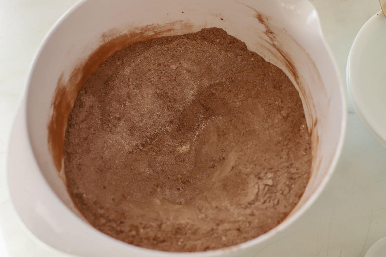 Dry ingredients for cake in a white bowl.