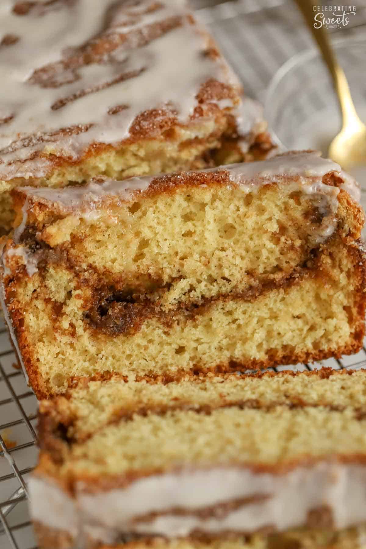 A slice of cinnamon swirl bread on a wire rack.