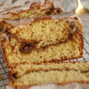 Slice of cinnamon swirl bread on a wire rack.