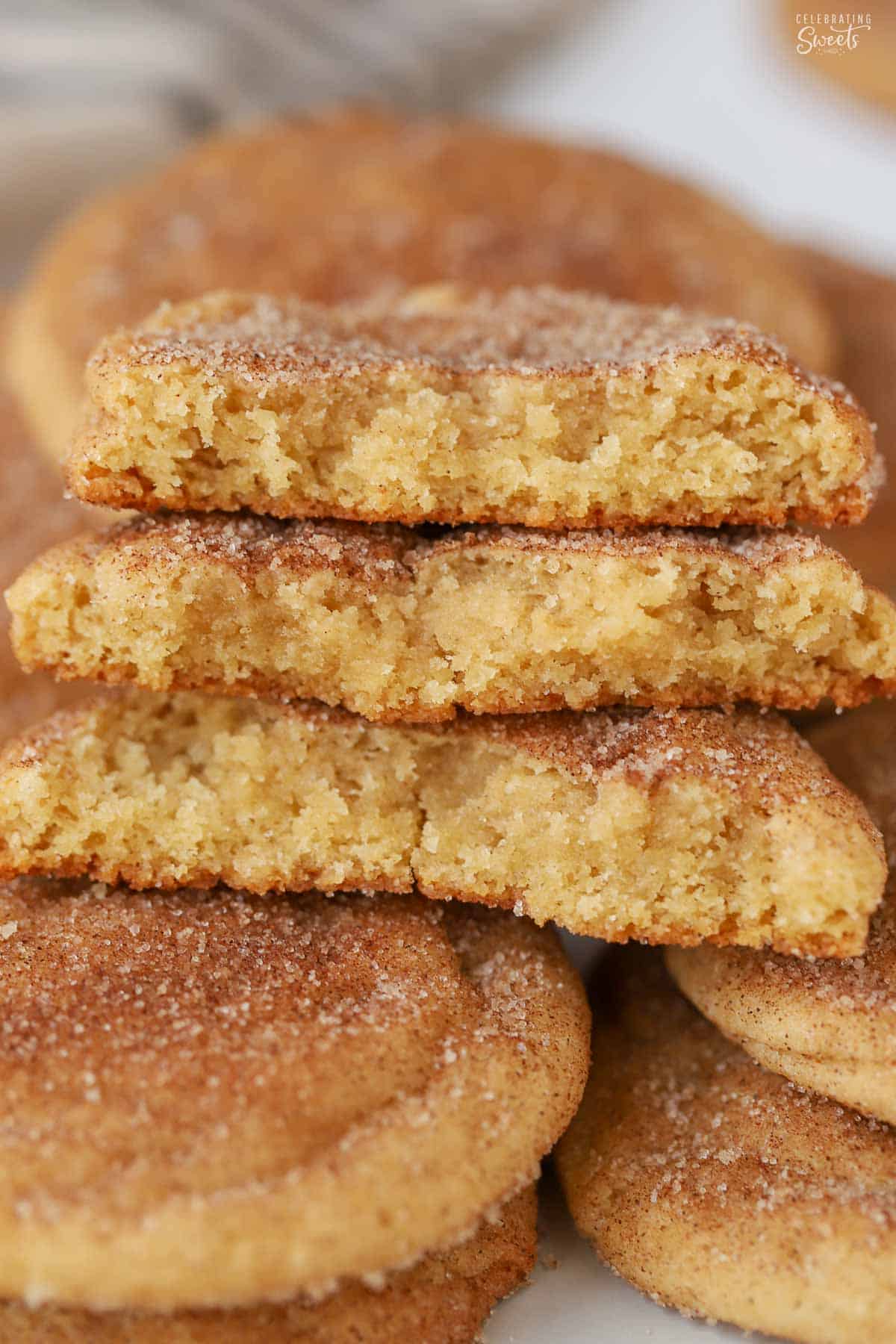 Three snickerdoodle cookie halves stacked on top of each other.