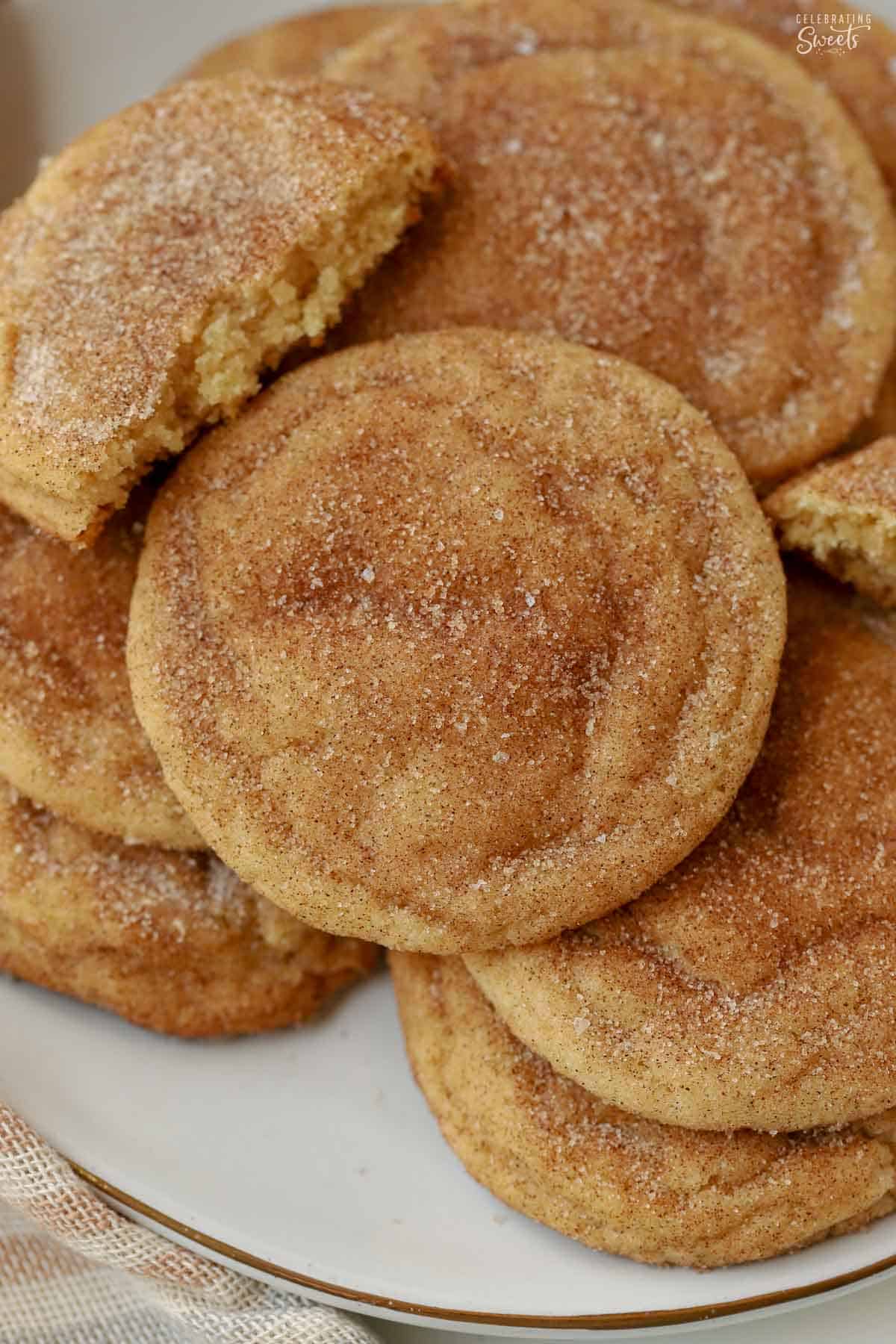 Snickerdoodle cookies piled on a grey plate.