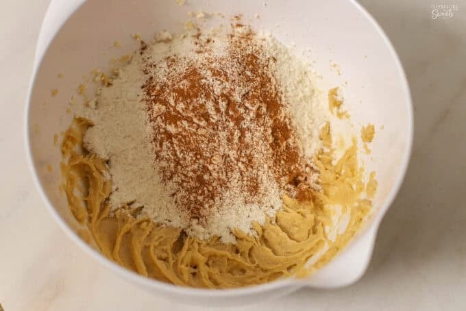 Snickerdoodle cookie dough batter in a white bowl.