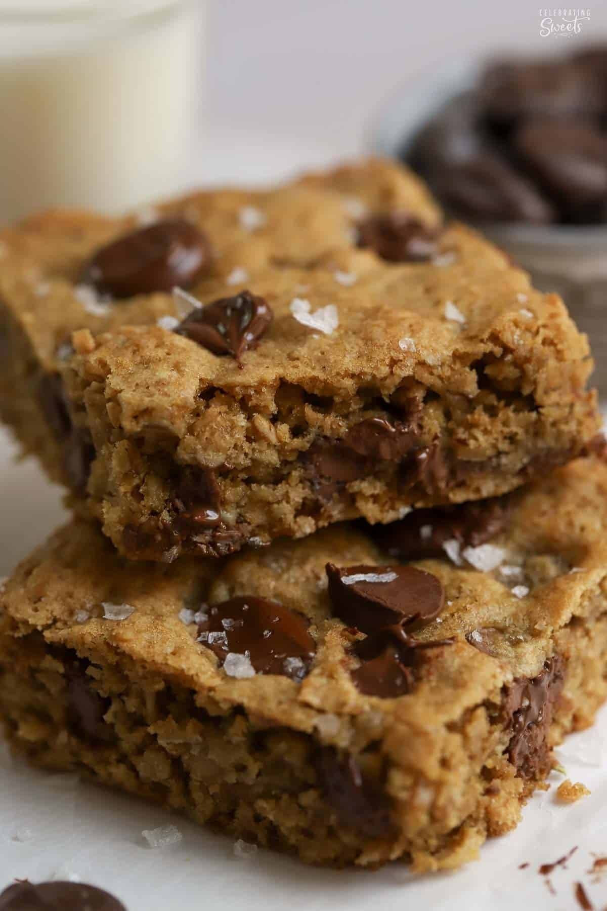 Stack of two oatmeal chocolate chip cookie bars stacked on top of each other.