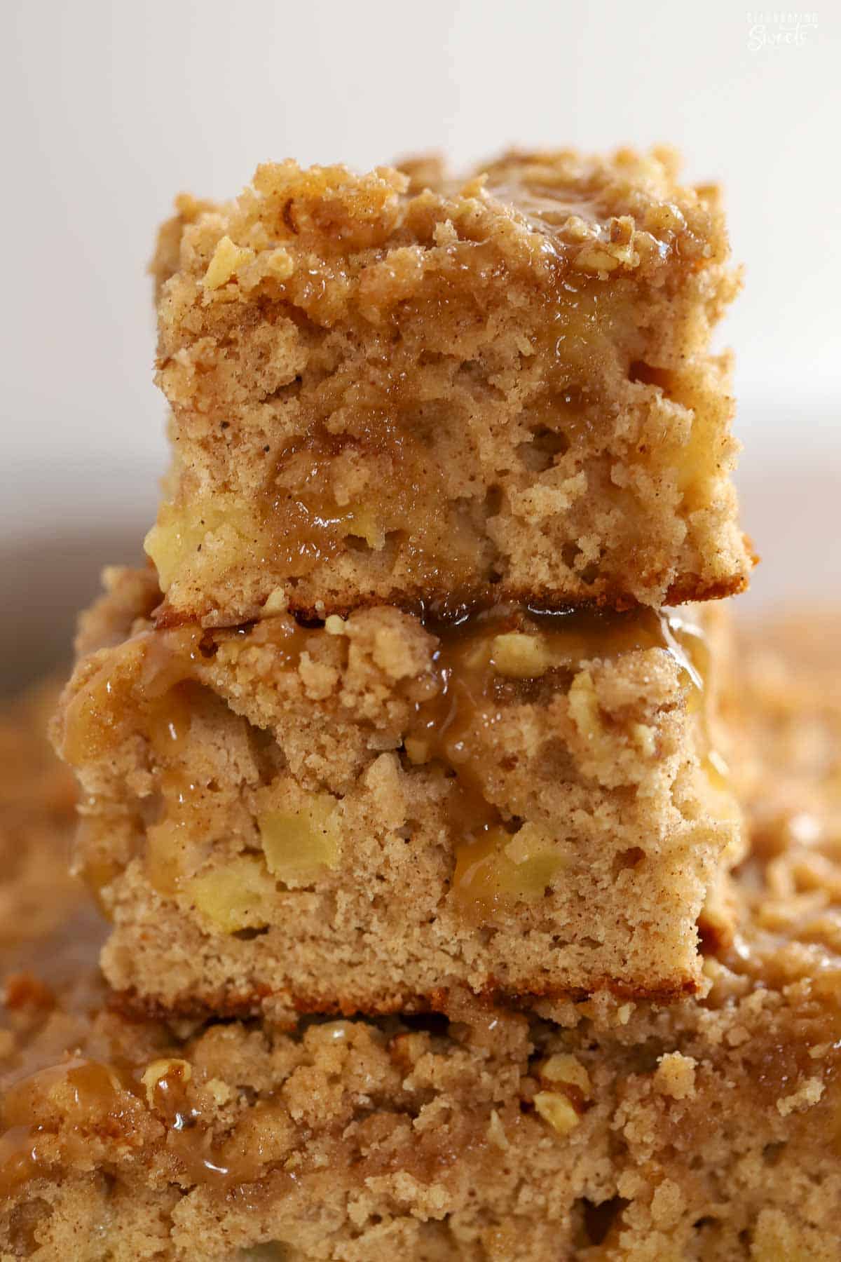 Two slices of apple crumb cake stacked on top of each other.