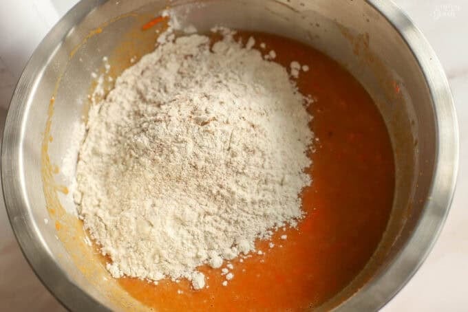 Pumpkin carrot cake batter in a metal bowl.