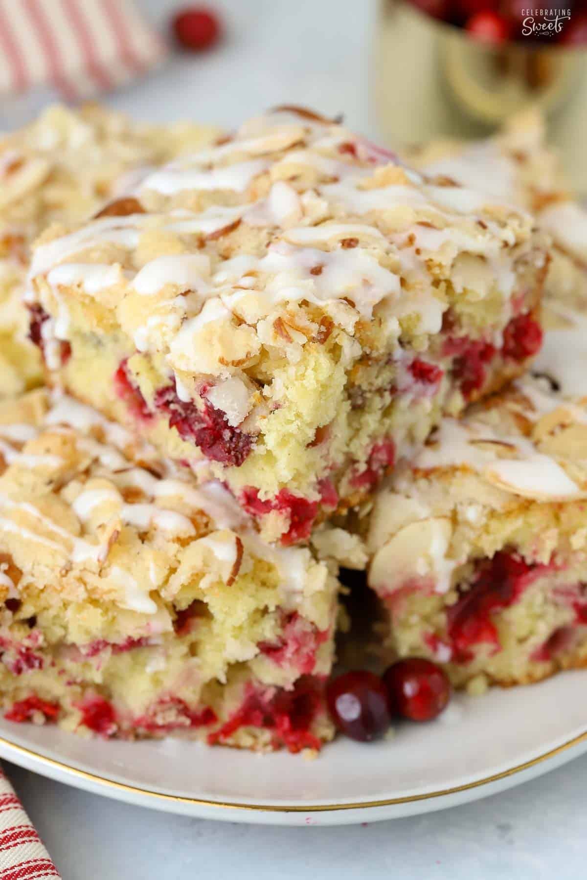 Three slices of cranberry cake on a grey plate.