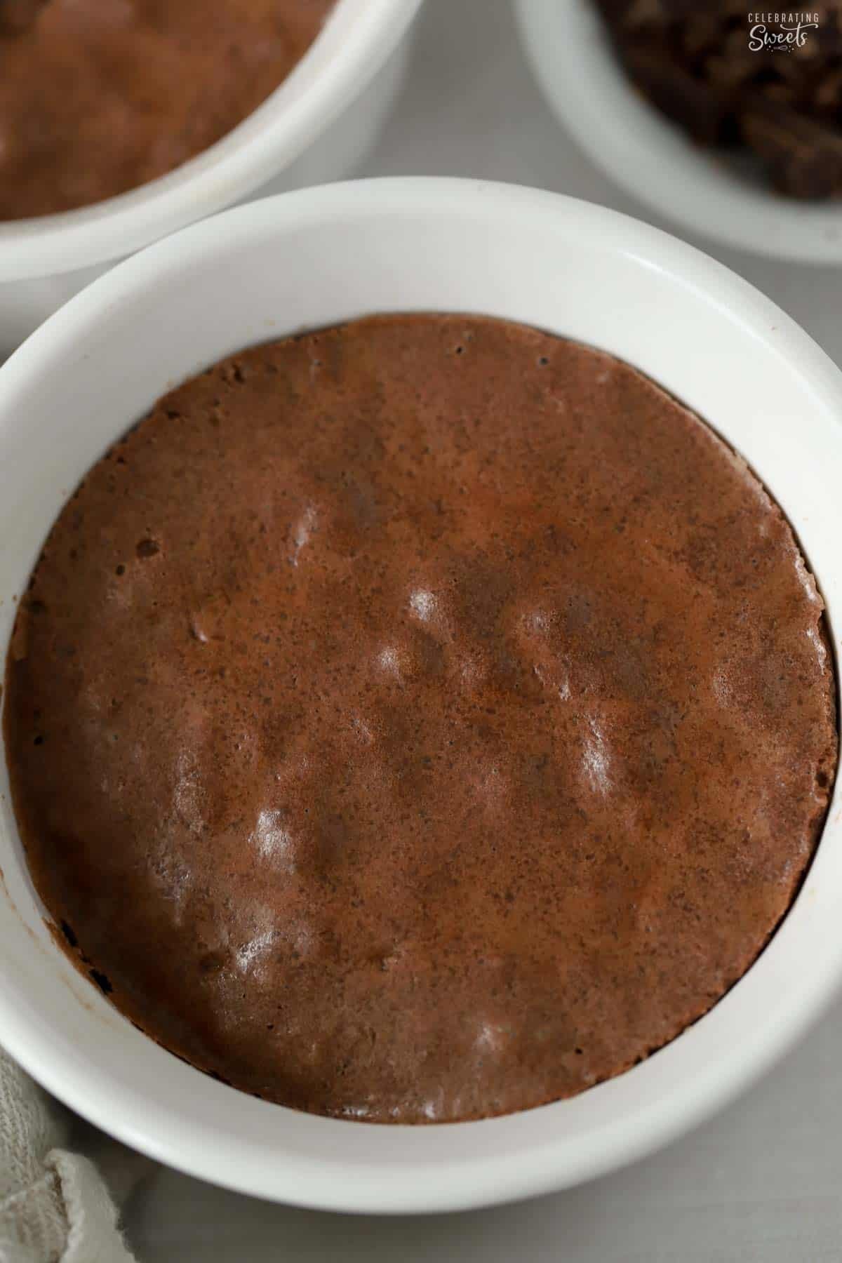 Overhead photo of brownie pudding in a white round ramekin.