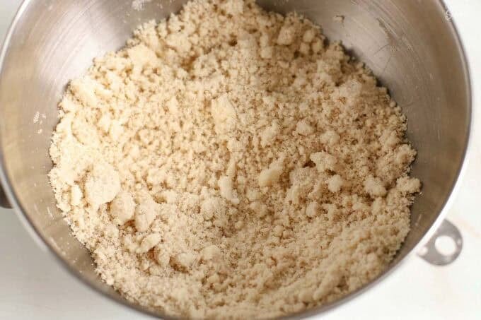 Crumb crust and topping in a stainless mixing bowl.