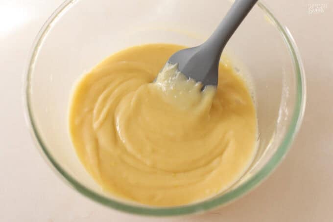 Lemon cake batter in a glass bowl.