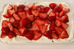 Strawberry tiramisu in a white rectangular baking dish.