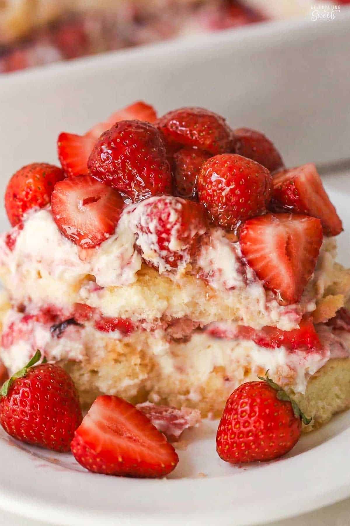 A serving of strawberry tiramisu on a white plate.