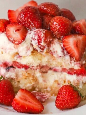 A serving of strawberry tiramisu on a white plate.