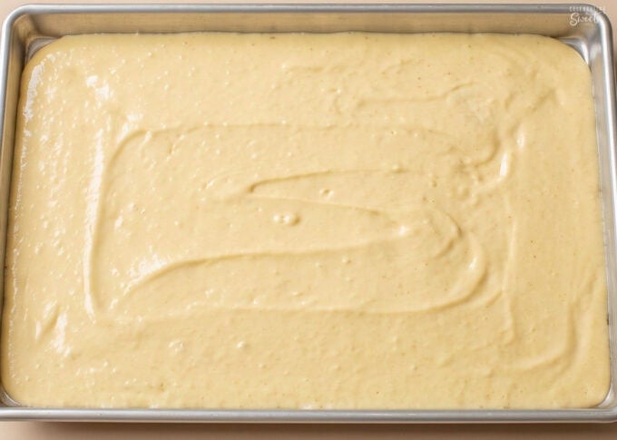White Texas sheet cake batter in a rectangular pan.