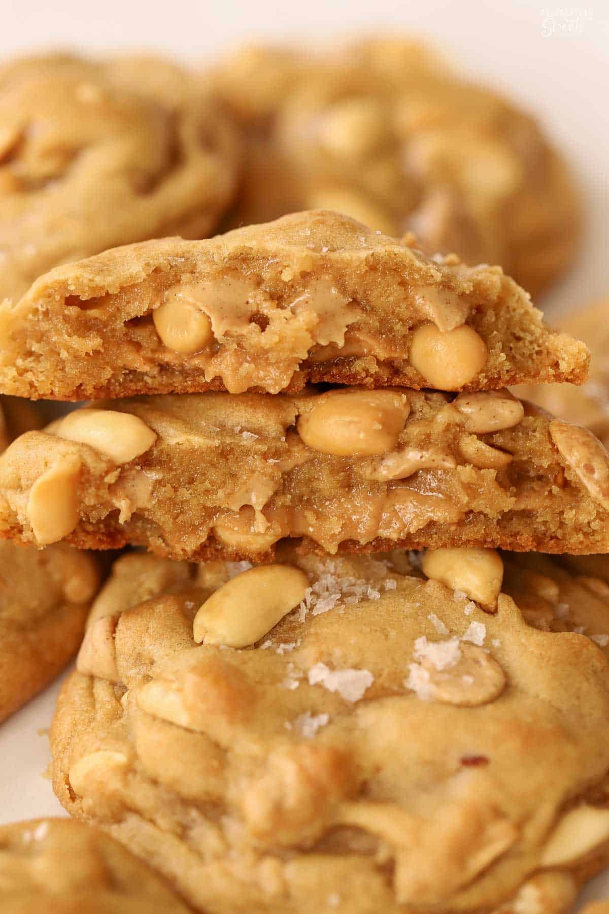 Peanut butter and honey filled cookies stacked on top of another cookie.